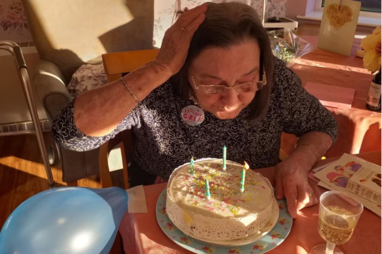 Jeanne blowing out her candles 