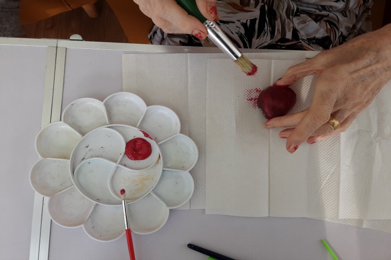 Residents Painting Stones 