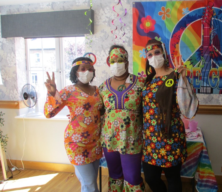 our staff members dressed up for the groovy party 