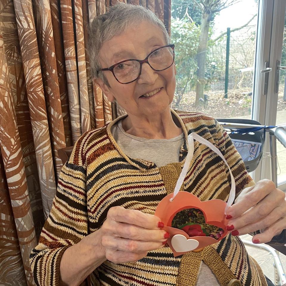 Our residents with the valentine's day cards they made