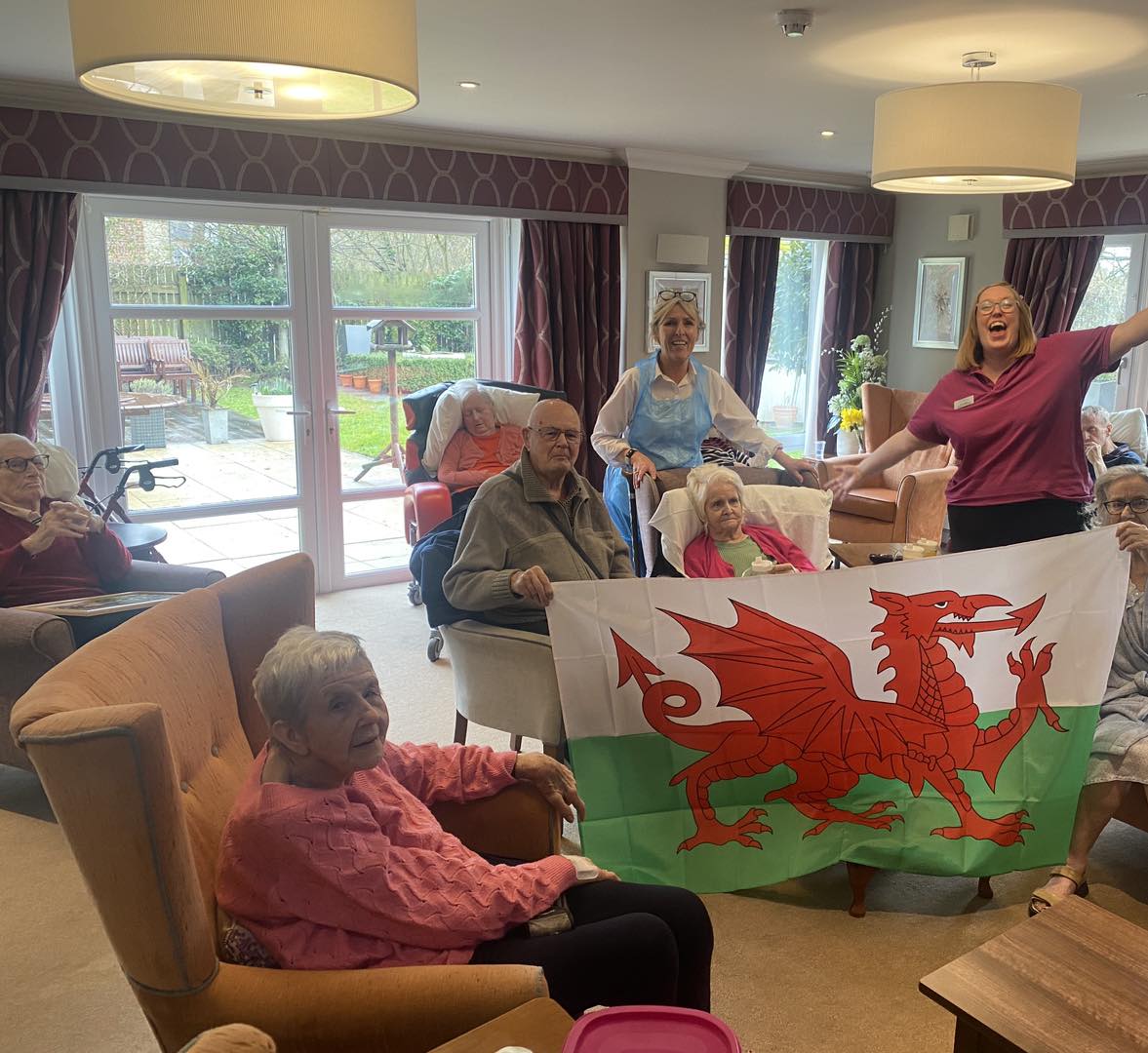 residents celebrating St David's day with a Welsh flag 