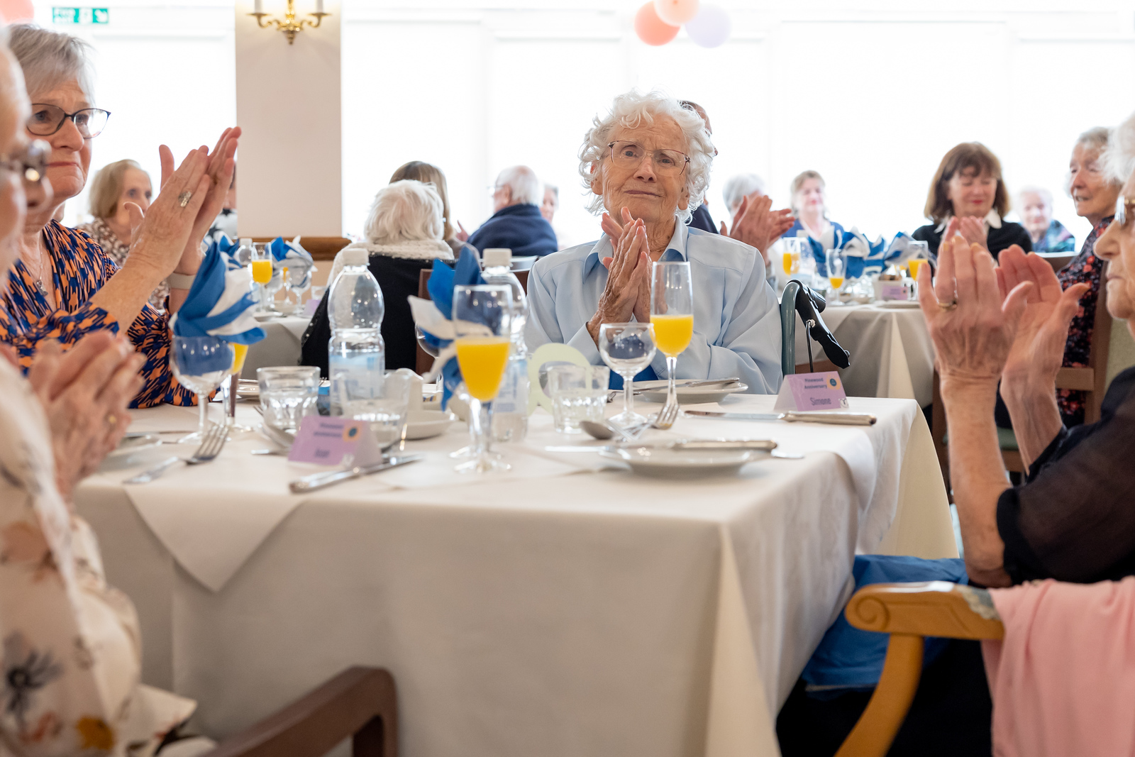 Pinewood's birthday party, residents watching entertainment 