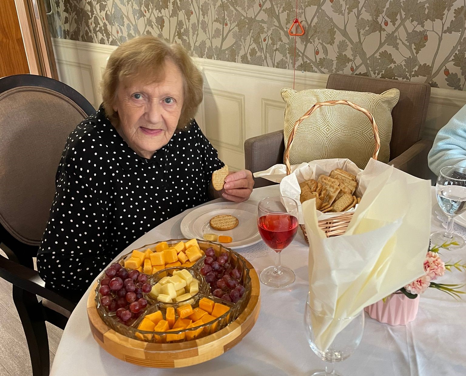 Lady enjoying cheese and wine night 