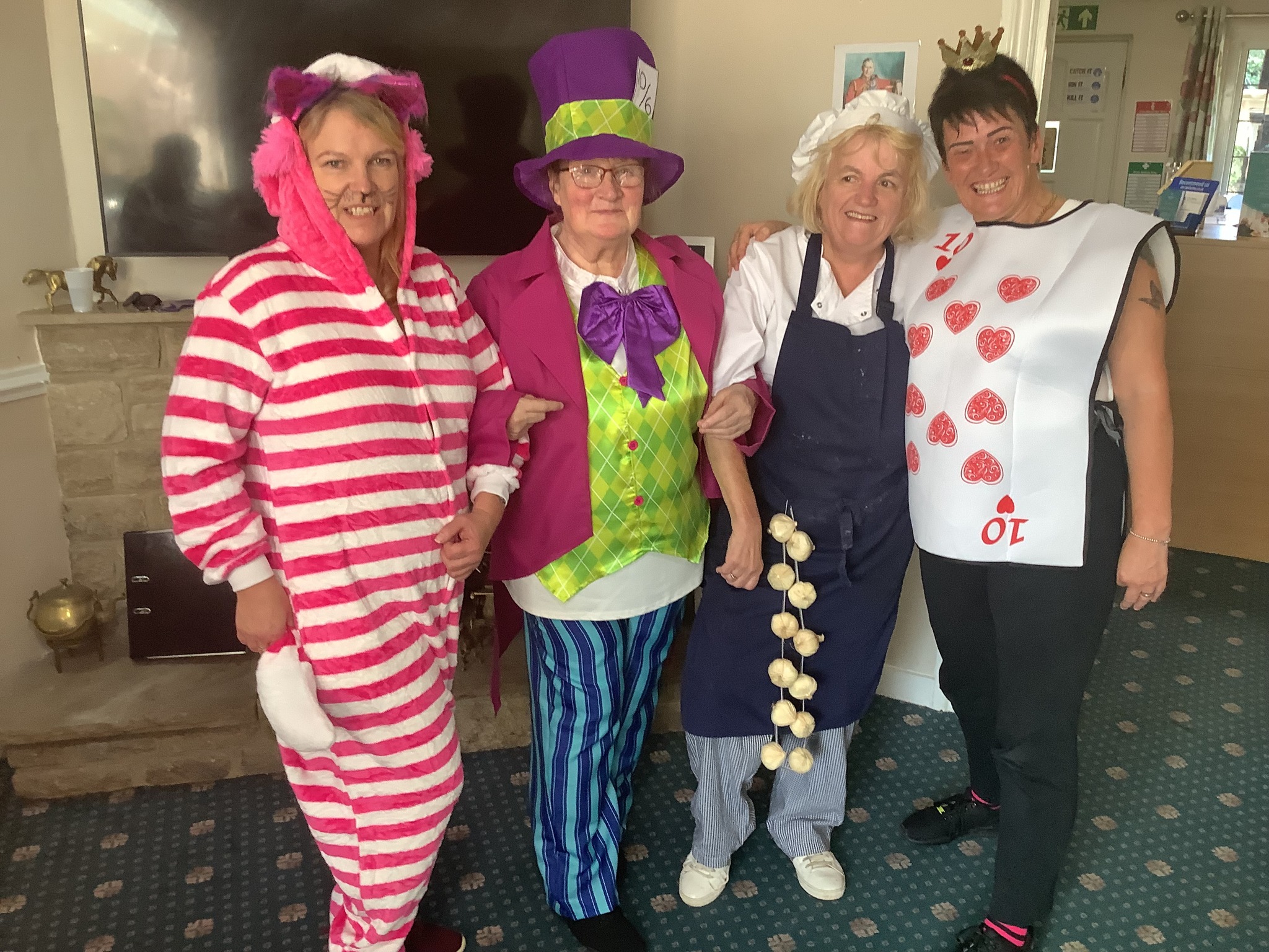 Staff in fancy dress at the tea party at Bridge House 