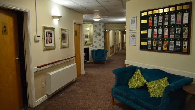 Manor Park hallway with notice board and seats 