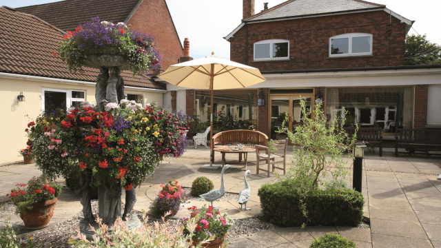 Highfield courtyard with outdoor seating and flowers 