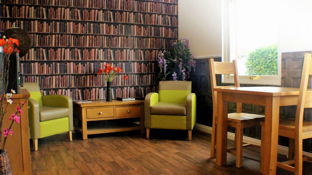 Astor Lodge coffee shop with seating and coffee machine