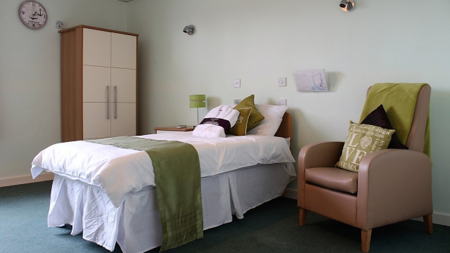 Barnes Court bedroom with single bed, chair and wardrobe