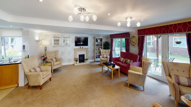 Parkview House lounge with TV and fireplace