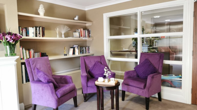 Buckingham House seating area and bookcase 