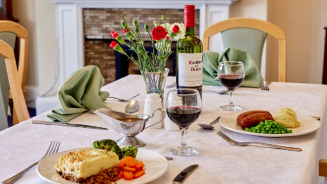 Furze Hill dining table with food and wine