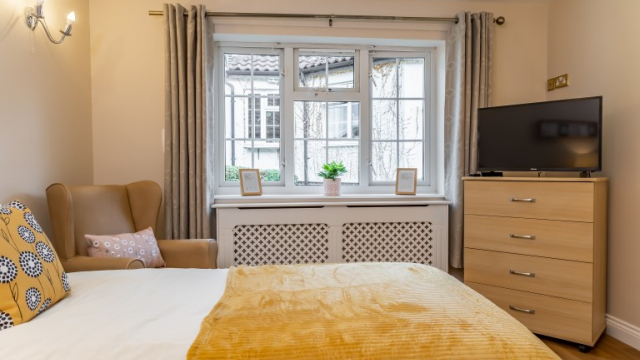 Belvoir Vale bedroom with TV and large window