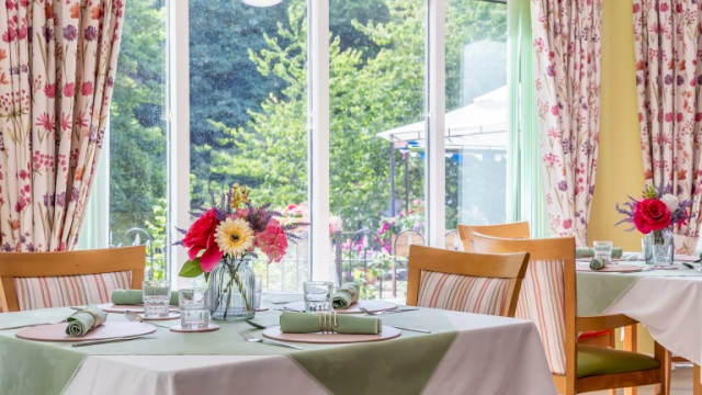 Dussindale Park dining table with flowers 
