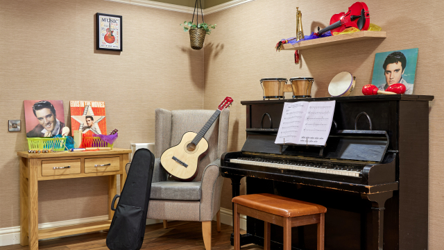 Brunel House music room with piano and guitar 
