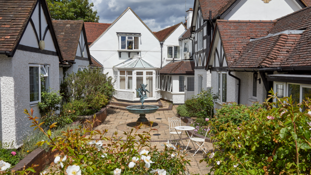 Bridge House courtyard with seating and water fountain