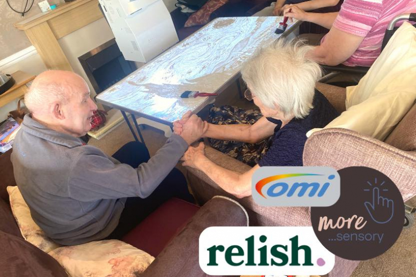 Residents using the sensory table 
