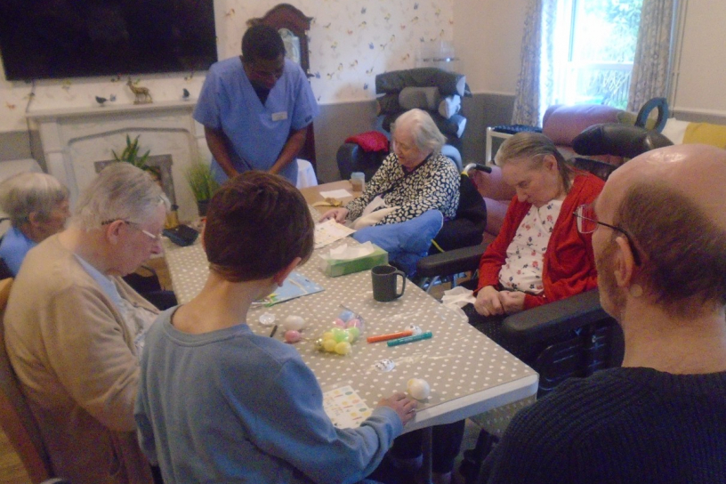Residents and local children enjoying Easter crafts together