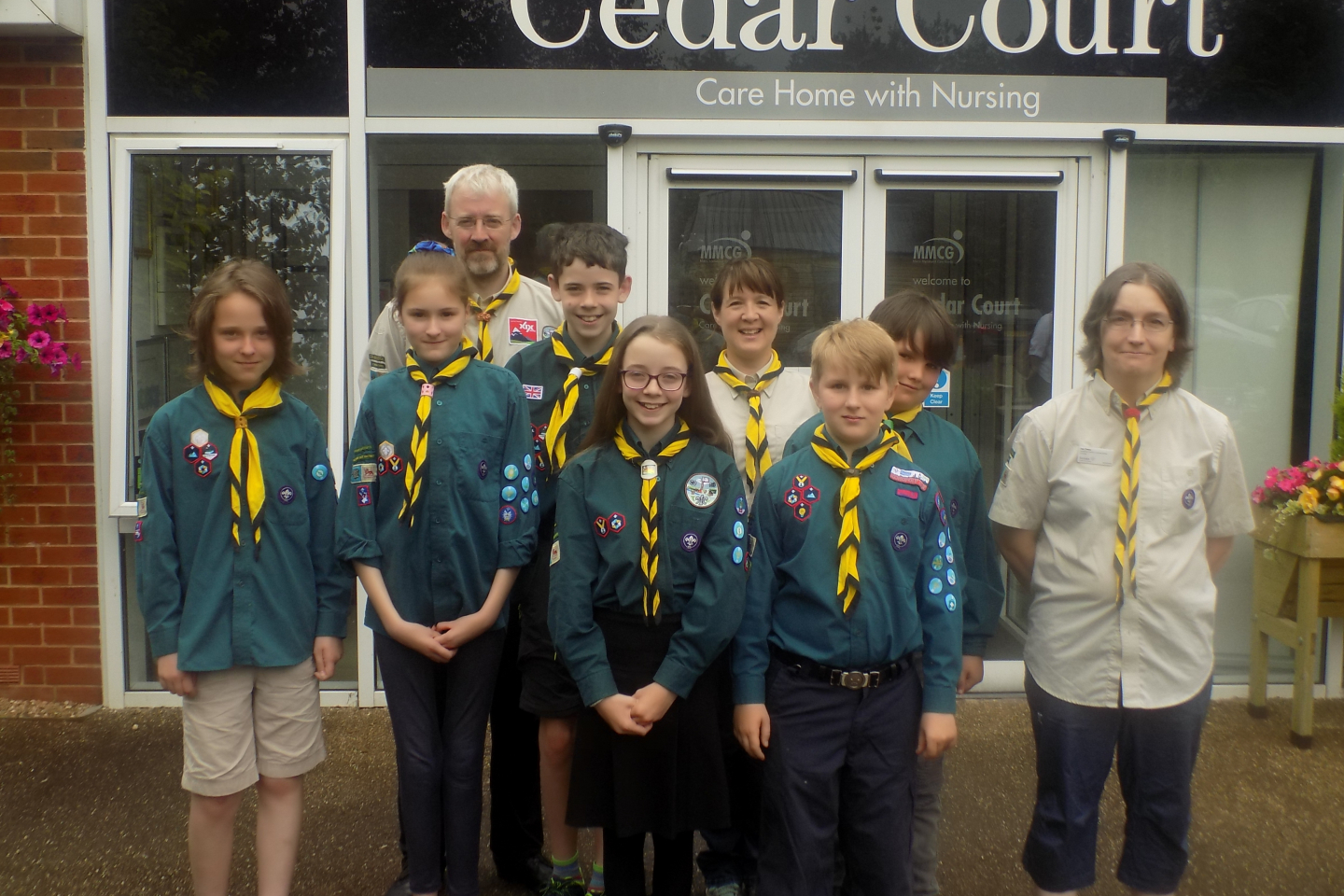 Cranleigh Scouts and staff members pictured outside of Cedar Court